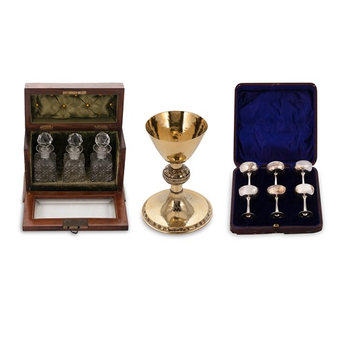 Lot 410 - A cased set of six silver communion cups, together with a chalice and holy oils set