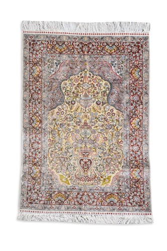 Lot 696 - A finely-woven silk and metal thread rug