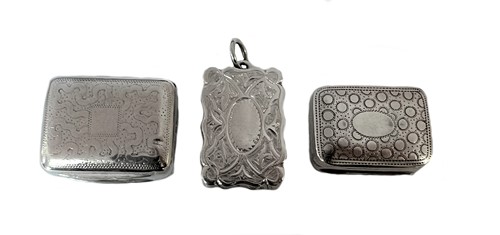 Lot 252 - Two George III silver miniature vinaigrettes together with a Victorian example