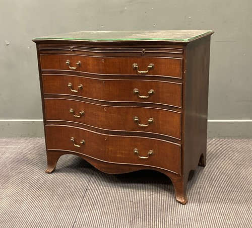 Lot 454 - A George III mahogany serpentine chest of drawers