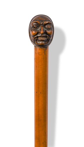 Lot 845 - A carved wood walking cane, late 19th or early 20th century