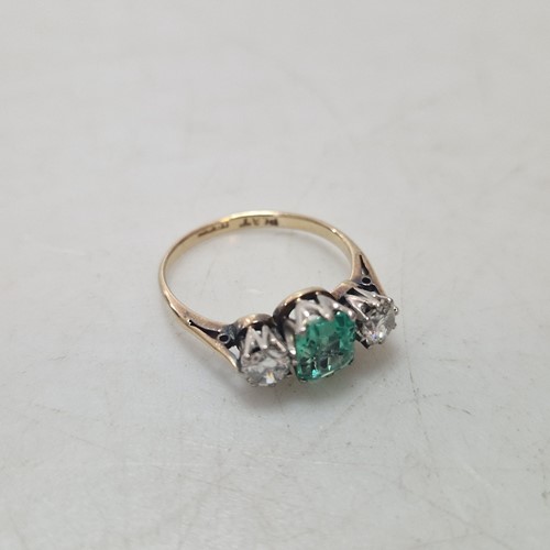 Lot 186 - A three stone ring, central stone assessed as...