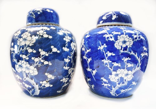 Lot 19 - A near pair of Chinese blue and white ginger jars and covers, Qing Dynasty, circa 1900