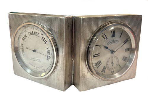 Lot 225 - Ortner & Houle, London - A late 19th century Sterling silver travelling timepiece & barometer