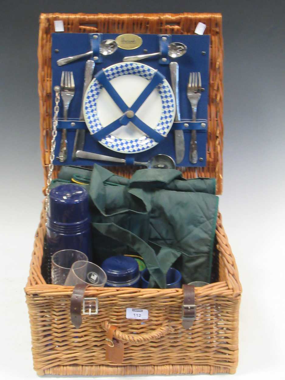 Lot 112 - A Harrods picnic set for two within a wicker...