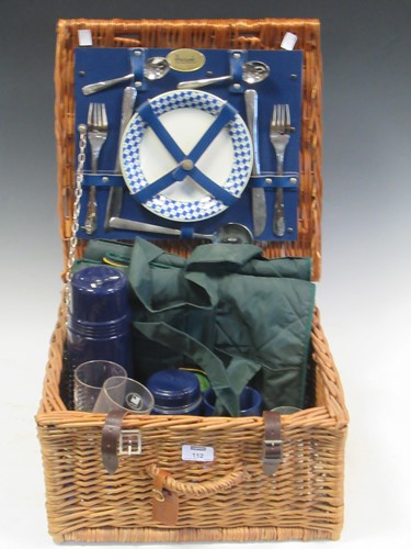 Lot 112 - A Harrods picnic set for two within a wicker...