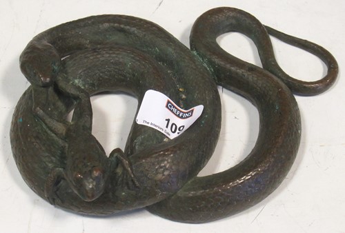 Lot 109 - A bronze model of a snake catching a frog,...