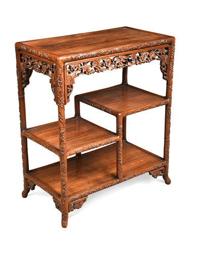 Lot 129 - A Chinese export carved hardwood étagère, late Qing Dynasty