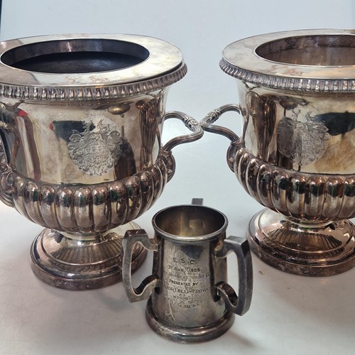 Lot 204 - A pair of plated wine coolers with collars,...