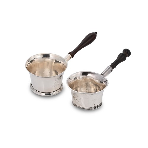 Lot 337 - A William III Britannia silver brandy pan, together with another example