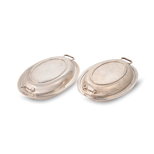Lot 450 - A pair of George V silver entrée dishes and covers