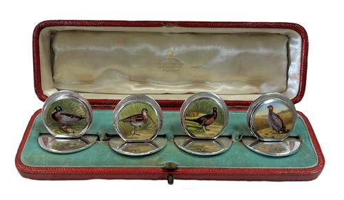 Lot 297 - A set of four early 20th century silver and enamel menu holders, mark of Sampson Mordan & Company