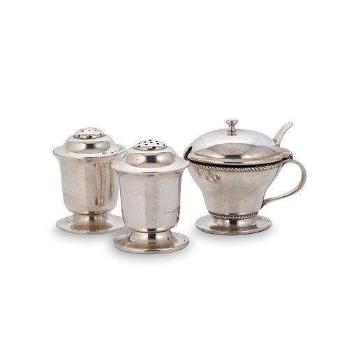 Lot 412 - A pair of Edward VII 'Arts & Crafts' style silver pepperettes and a mustard, mark of Liberty & Co.