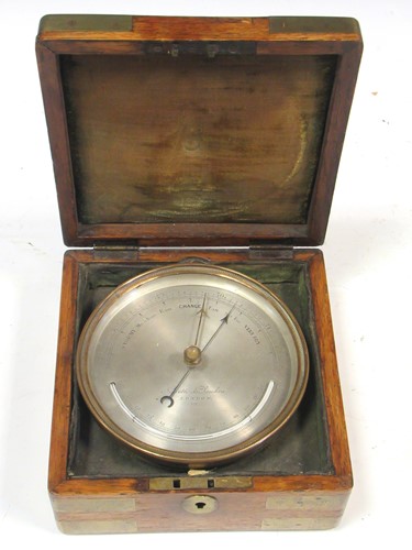 Lot 128 - An oak boxed aneroid barometer by Negretti &...