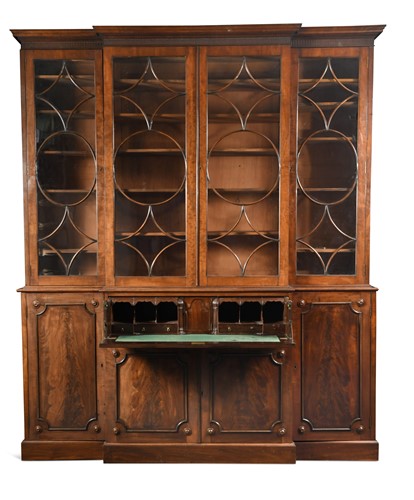 Lot 779 - A George III mahogany breakfront secretaire bookcase