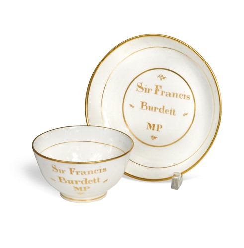Lot 499 - An English porcelain tea bowl and saucer