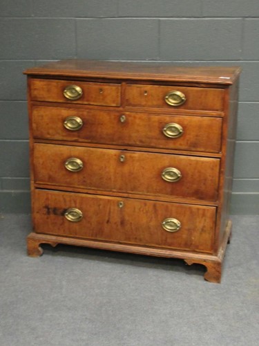 Lot 439 - A George III walnut and elm chest