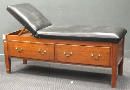 Lot 487 - An early 20th century oak Doctors couch by...