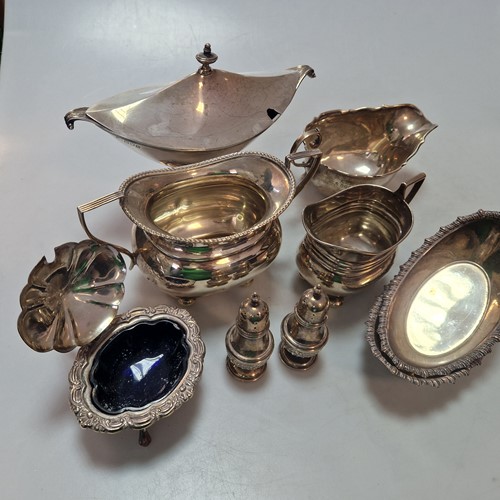 Lot 212 - A quantity of silver including cruets, casters,...