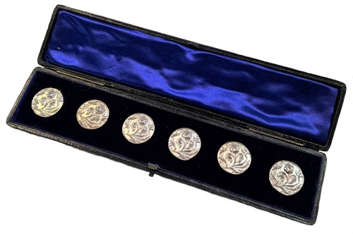 Lot 266 - A cased set of six early 20th century cast silver 'Art Nouveau' style buttons