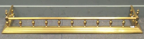 Lot 486 - A Georgian style polished brass fender with...