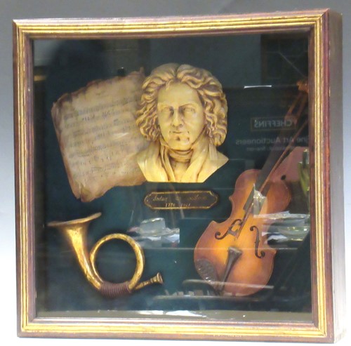 Lot 157 - A glazed cased display of musical trophies...