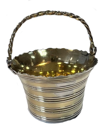 Lot 298 - A George II parcel gilt swing handled cream pail