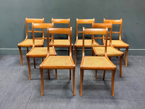 Lot 361 - A set of 8 Regency satinwood chairs with cane...
