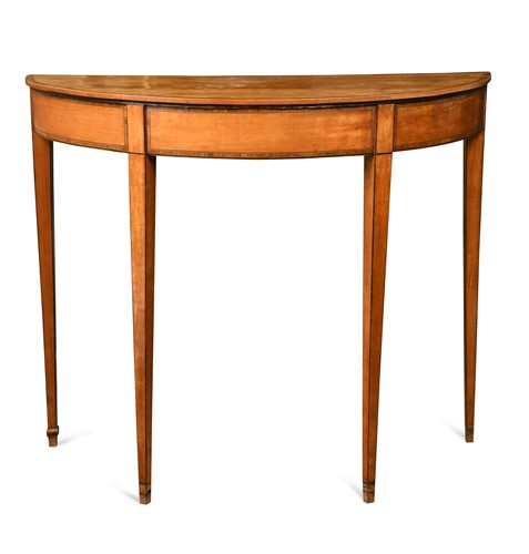 Lot 563 - A George III satinwood demi-lune pier table