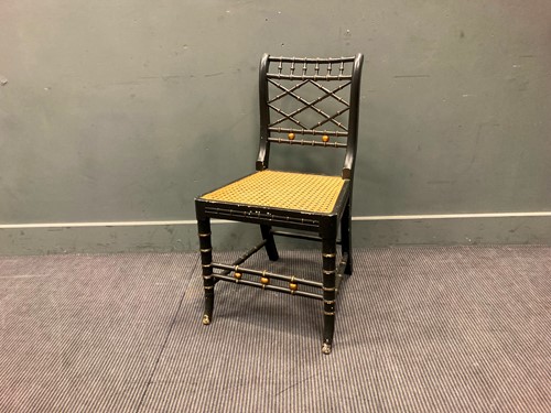 Lot 345 - A Regency style ebonised faux-bamboo chair...