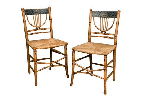 Lot 629 - A pair of painted Regency faux bamboo side chairs