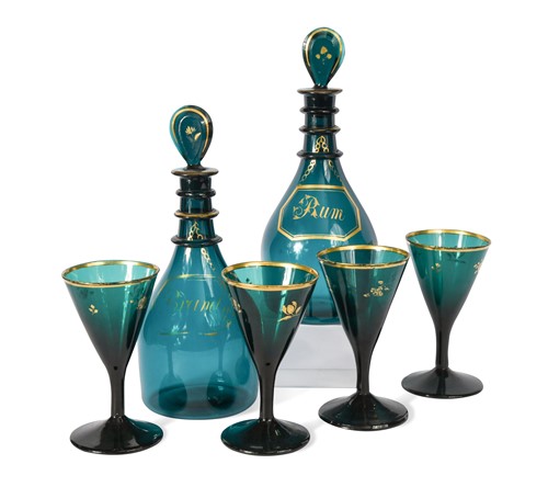 Lot 577 - A pair of Regency green glass triple neck decanters