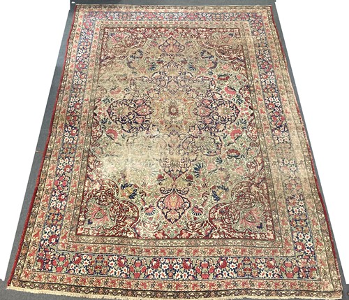 Lot 563 - A Persian design wool rug, possibly Kirman,...