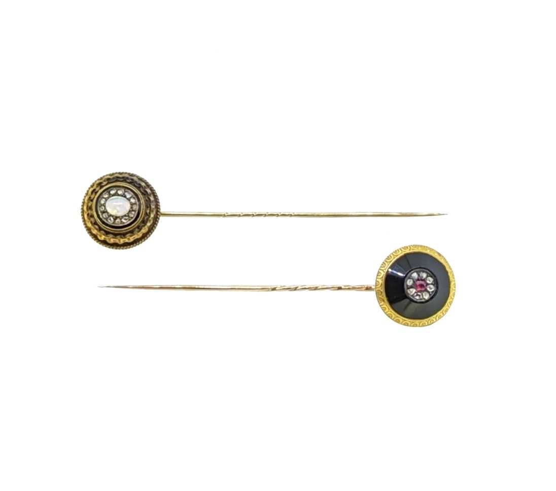 Lot 8 - Two diamond set stick pins