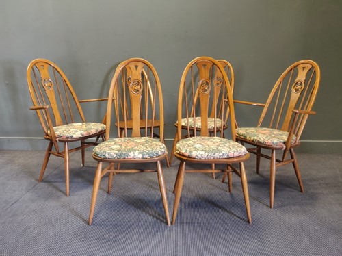 Lot 406 - A set of six Ercol Swan chairs in elm, circa...