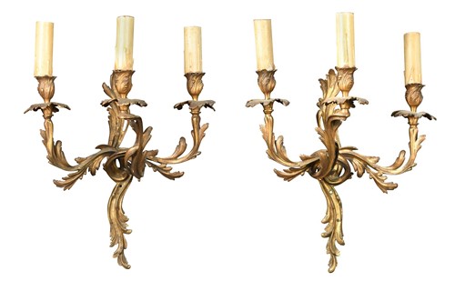 Lot 587 - A group of four Rococo-style three-branch wall lights