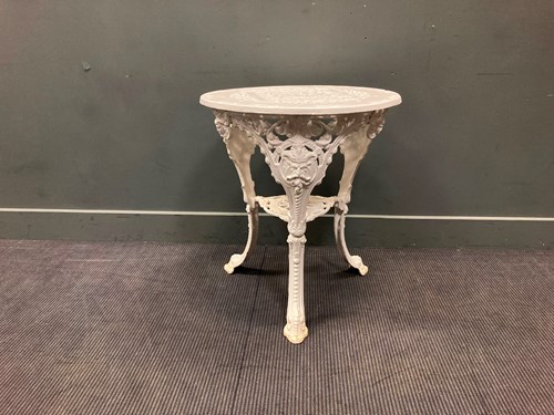 Lot 498 - A white painted cast iron pub table with green...
