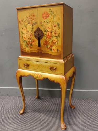 Lot 416 - A green and floral painted cabinet on...