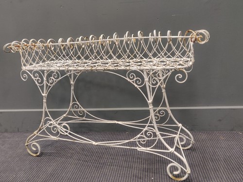 Lot 499 - A wirework planter 55 x 88 x 43cm