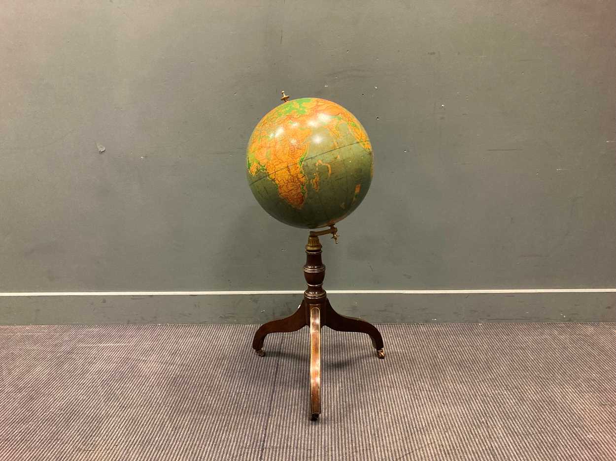 Lot 412 - A 19th century brass line inlaid globe stand...