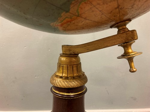 Lot 412 - A 19th century brass line inlaid globe stand...