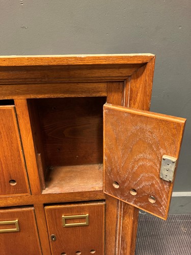 Lot 479 - A 20th century oak post box wall cabinet,...