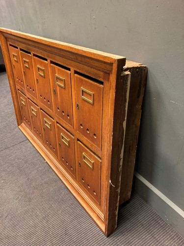Lot 479 - A 20th century oak post box wall cabinet,...