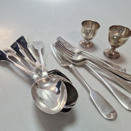 Lot 210 - An assortment of silver forks and spoons,...