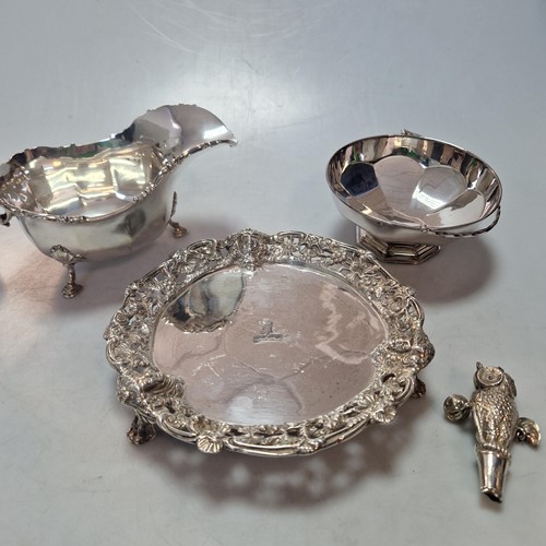 Lot 209 - A silver sauceboat, a silver waiter, a silver...