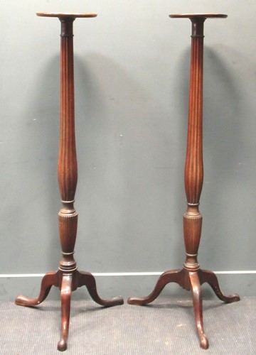 Lot 456 - A pair of mahogany torchiere stands, the...