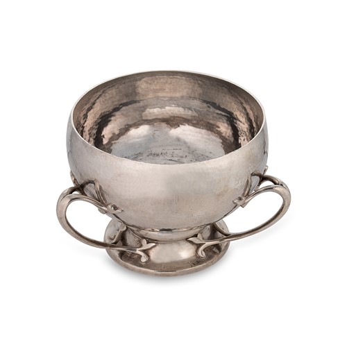 Lot 414 - An Edward VII silver 'Arts & Crafts' style three handled fruit bowl