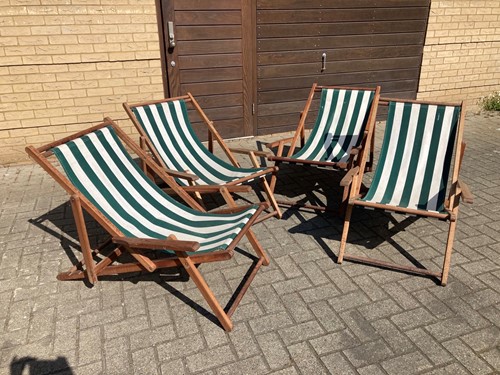 Lot 501 - A matching set of four hardwood deck chairs...