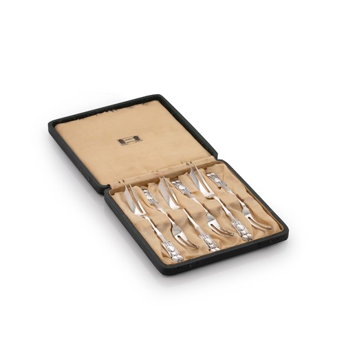 Lot 432 - Archibald Knox for Liberty - A set of six George V silver pastry forks