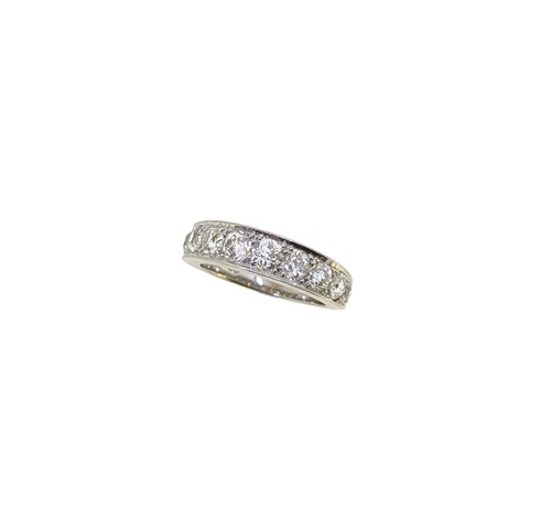 Lot 142 - A platinum half hoop style diamond ring